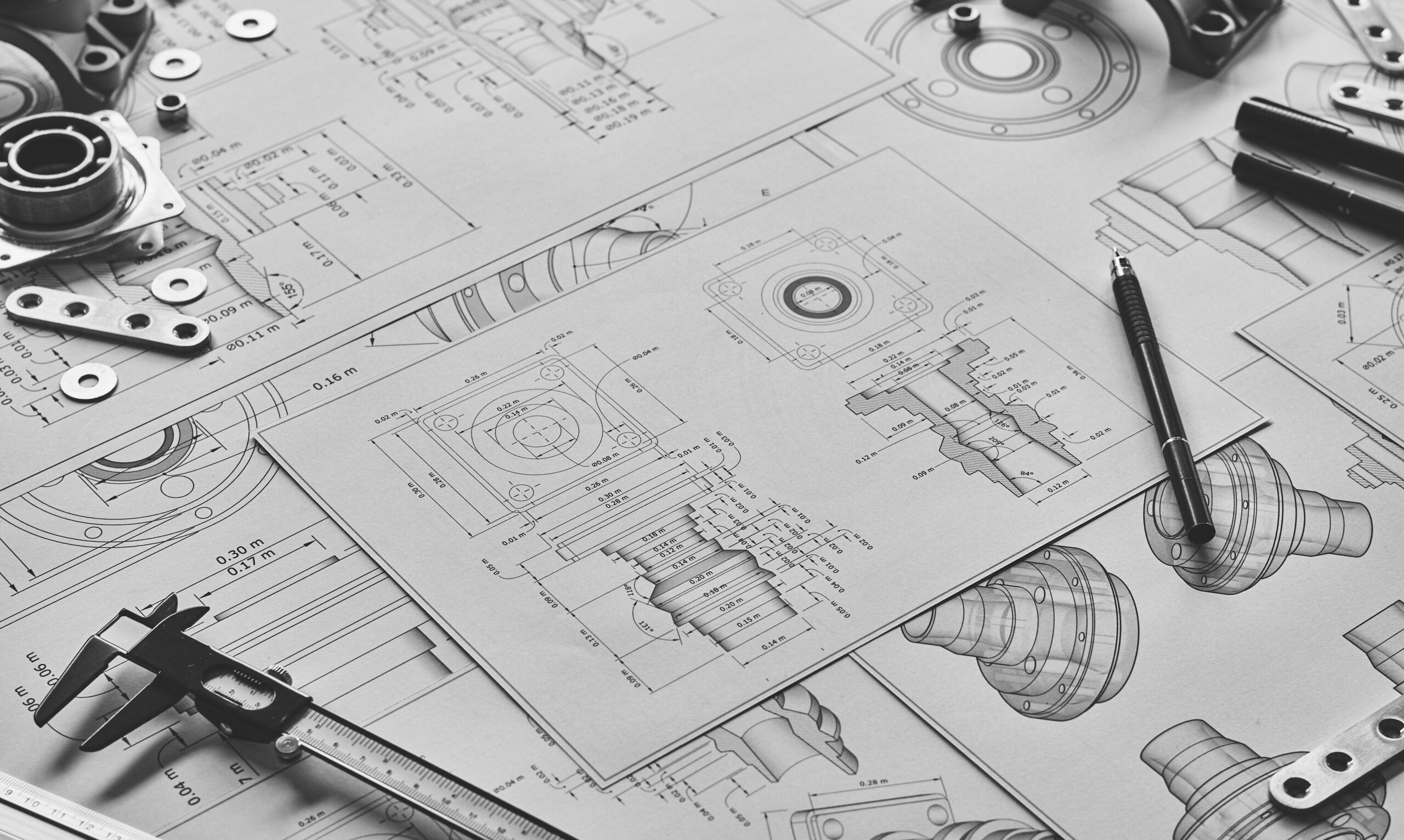 Engineer technician designing drawings mechanical parts enginee Engineer technician designing drawings mechanical parts engineering Engine manufacturing factory Industry Industrial work project blueprints measuring bearings caliper tools.